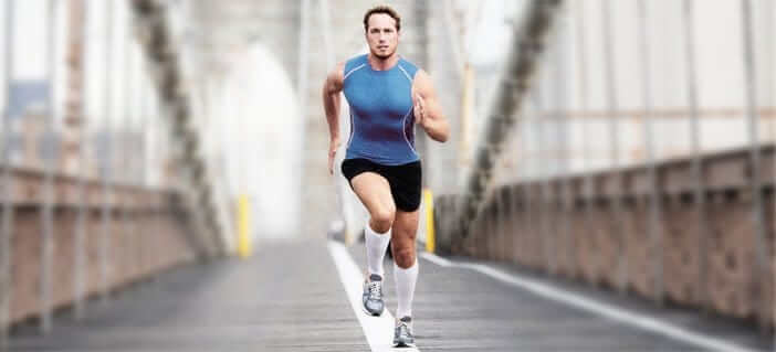 A man runs across the bridge in NYC